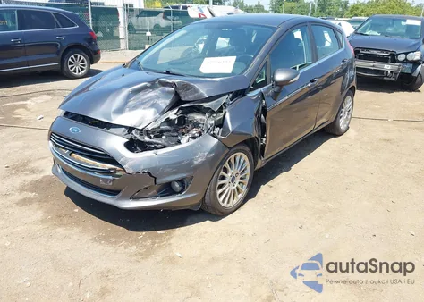 2016 Ford Fiesta Titanium z USA, uszkodzony, nr VIN 3FADP4FJ6GM180232